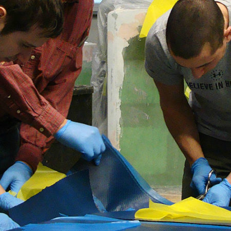 Crew preparing pre-preg carbon